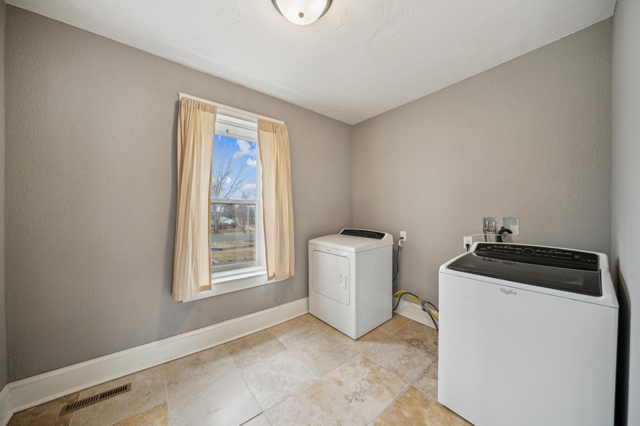 A large convenient laundry room completes the upper level