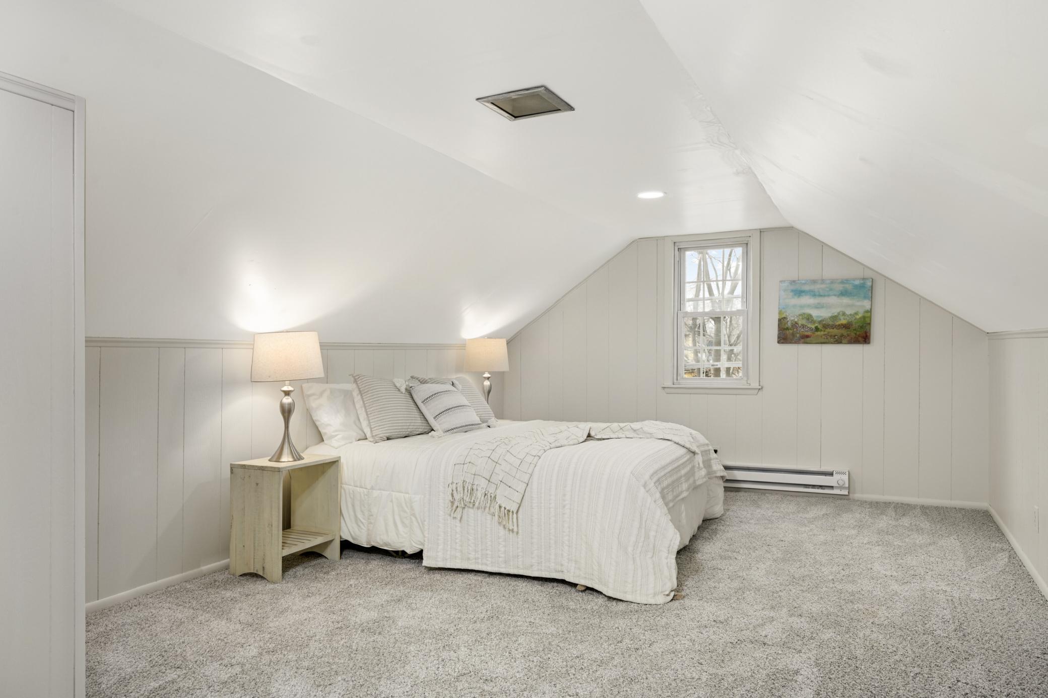 Spacious upper level bedroom could also be used as a family room if desired.