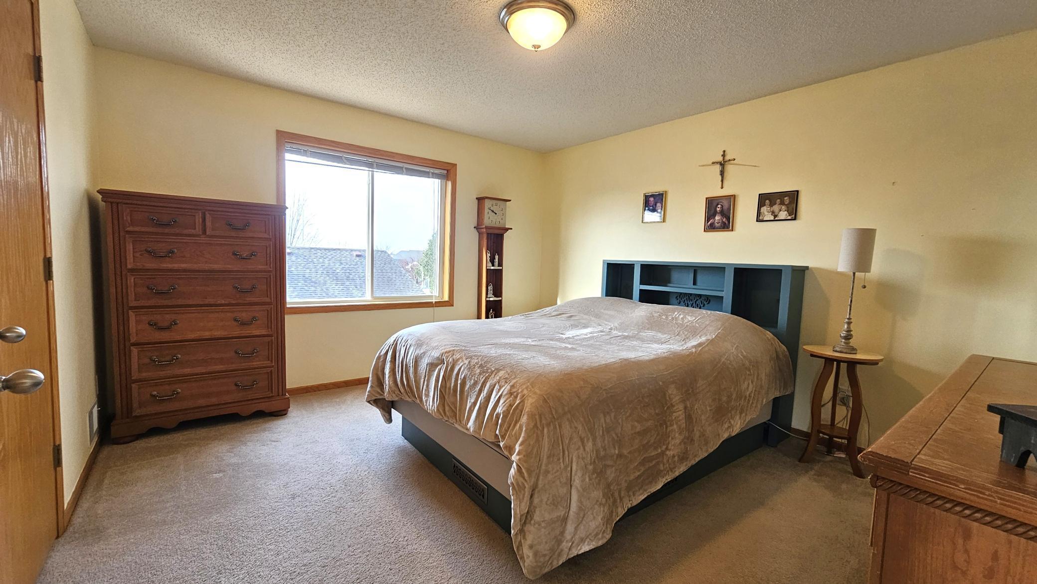 Spacious primary bedroom on upper level.