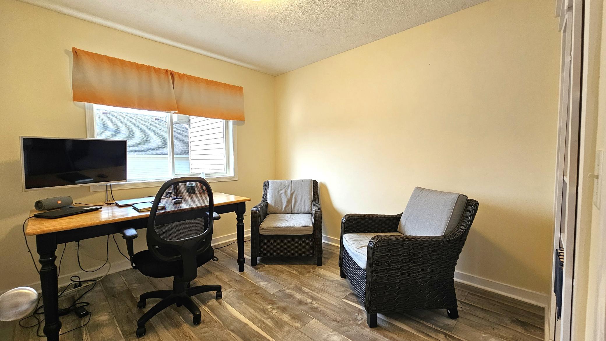 Main floor office with murphy closet.