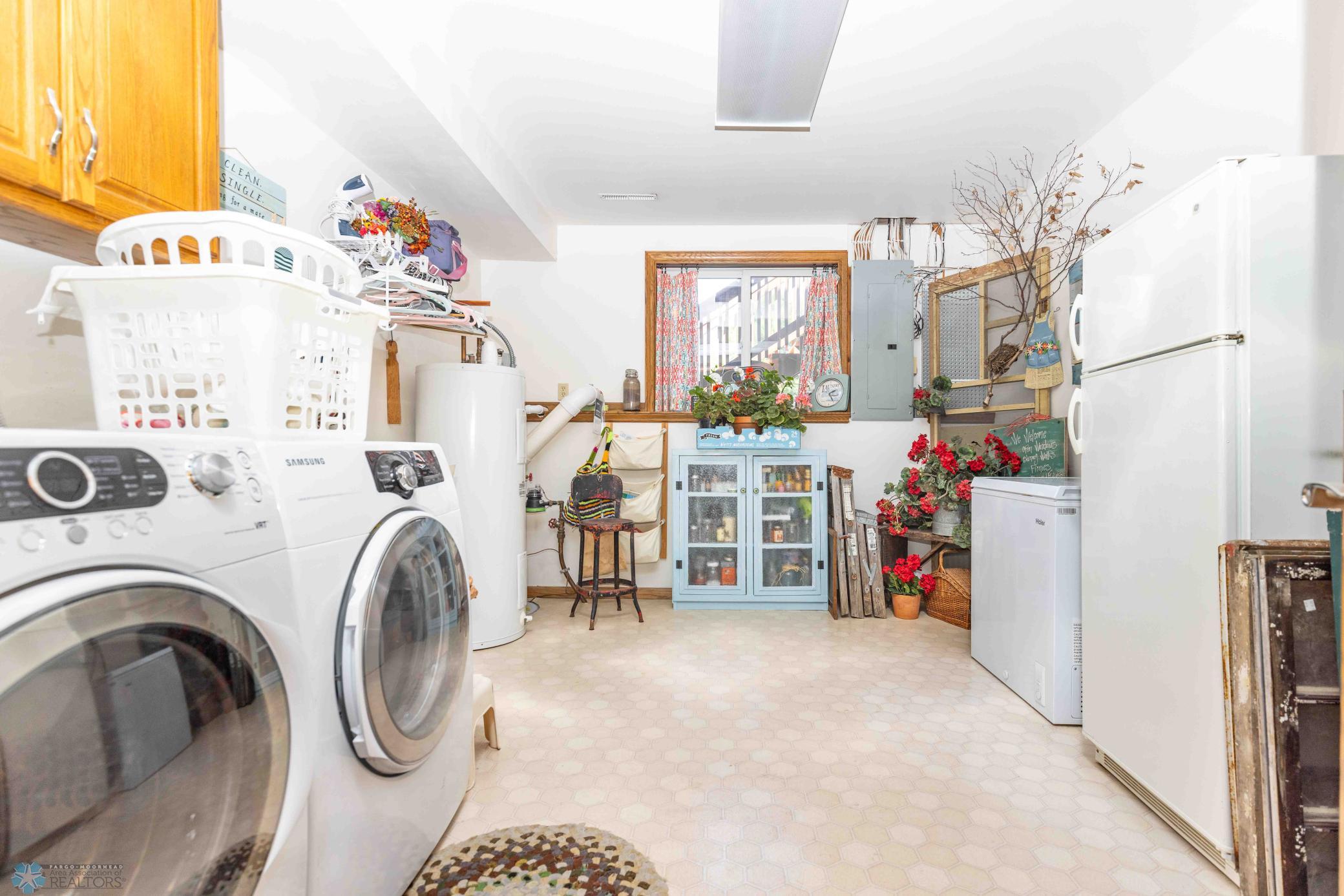 Laundry room refrigerator and freezer are not included.