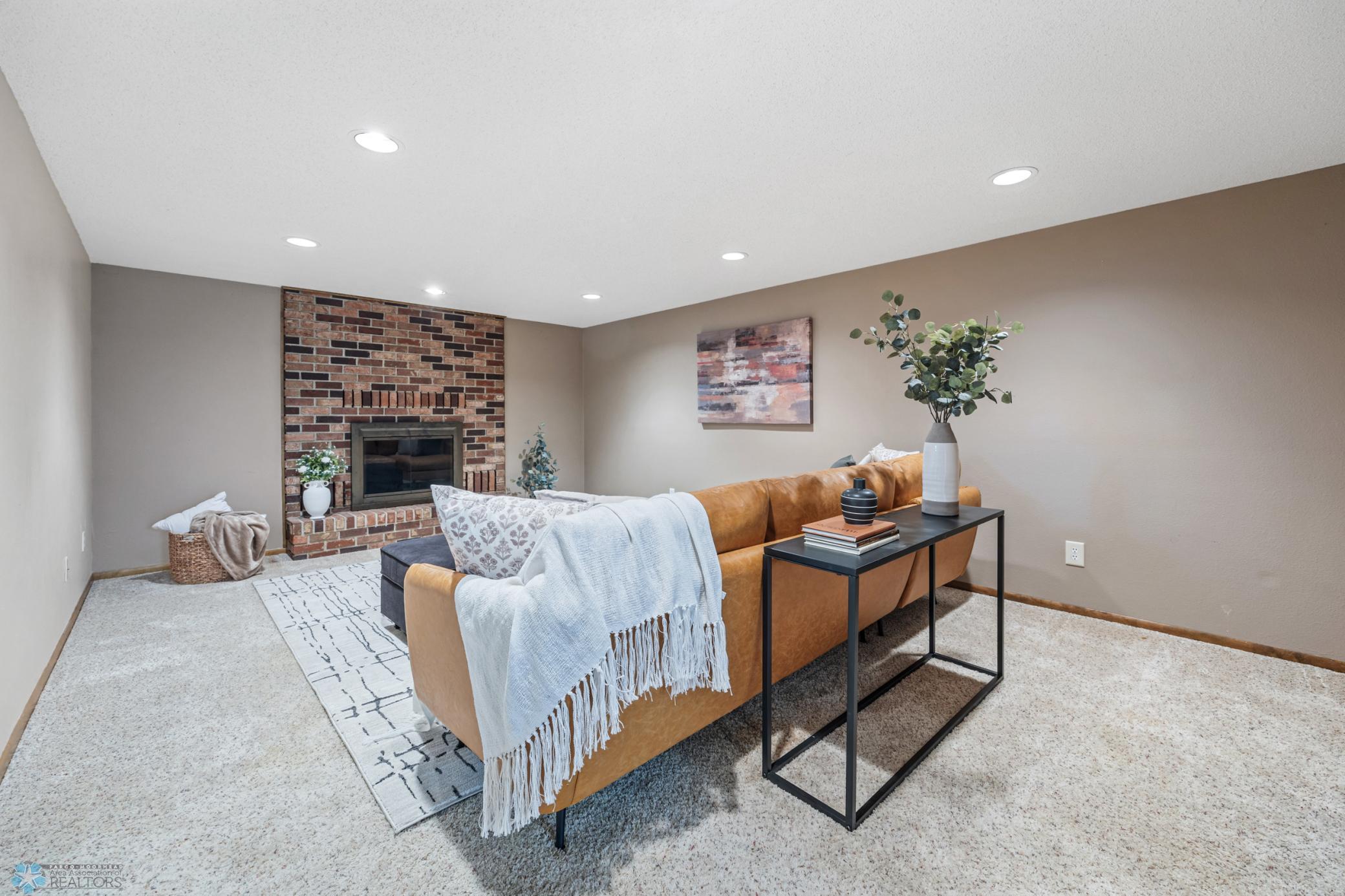 Lower Level Living Room w/ Wood-burning Fireplace