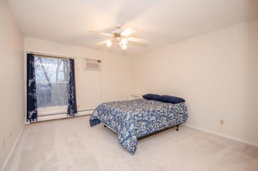 One of two bedrooms. Primary suite offers dual closets, separate vanity with walk-in shower and toilet.