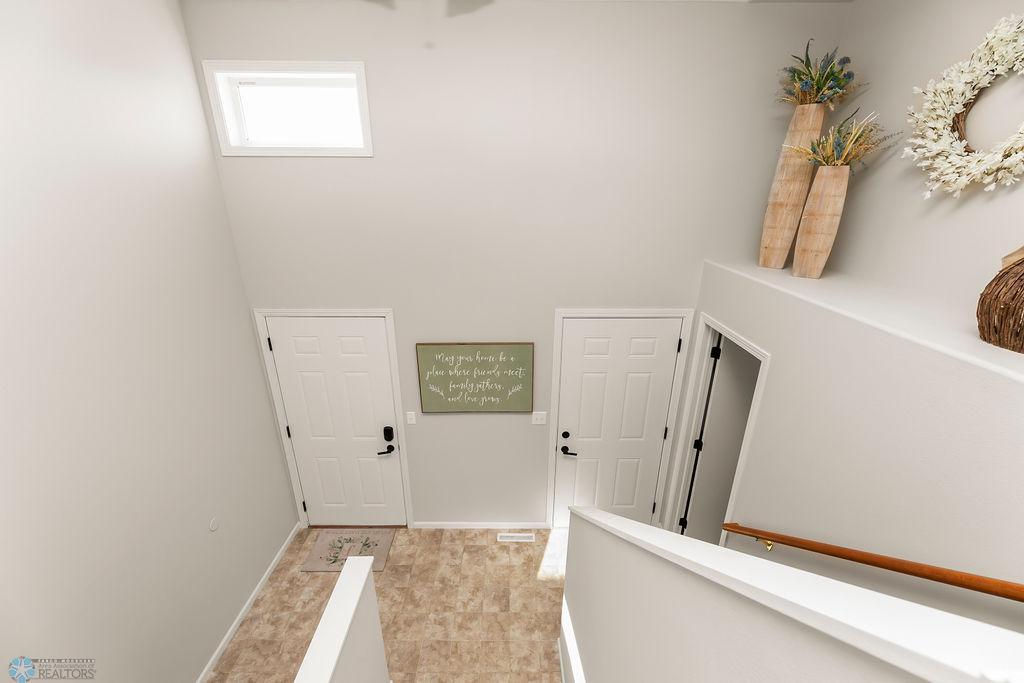 Spacious foyer with high ceilings, drop zone & closet!