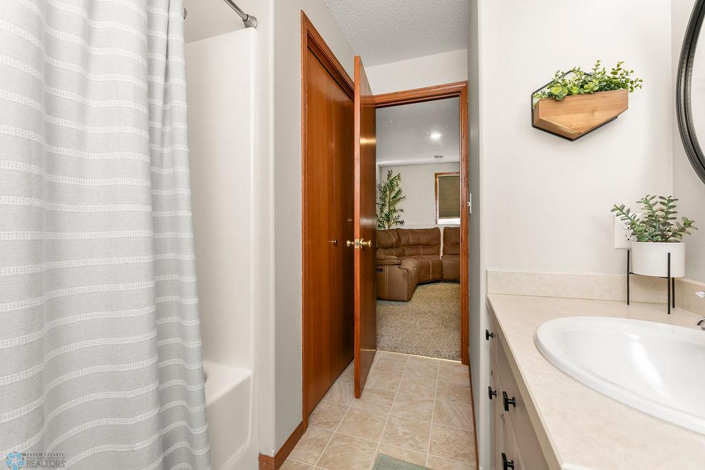 Full Bathroom with closet for storage/linens
