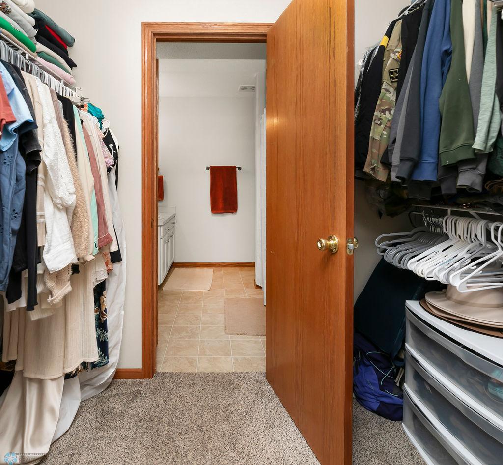 Large walk-through closet in Primary