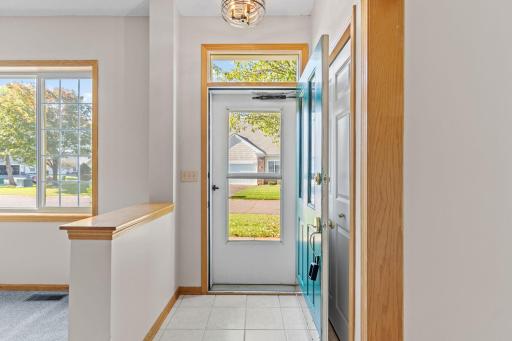 Entry foyer with quality tile flooring and bonus transom window