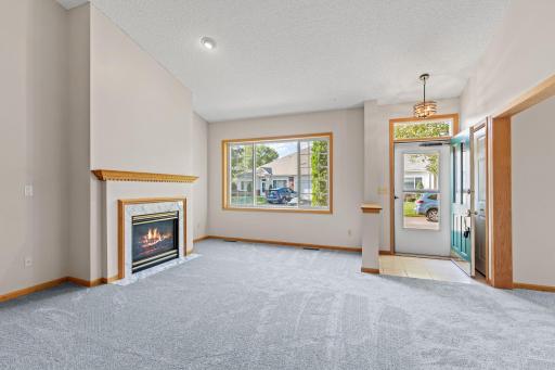Another living room view with south facing picture window offers light & bright spaces