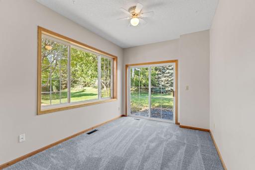 Enjoy your favorite book in your relaxing sunroom with plenty of windows & sliding door to private patio