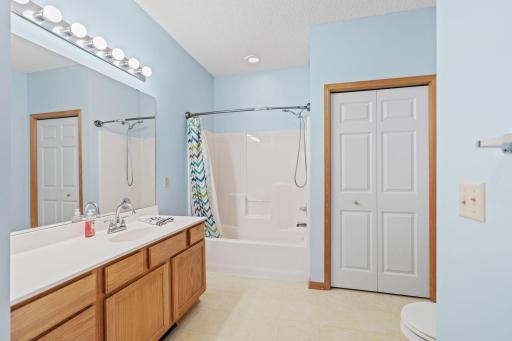 Primary bedroom features full private bath & extra large linen closet