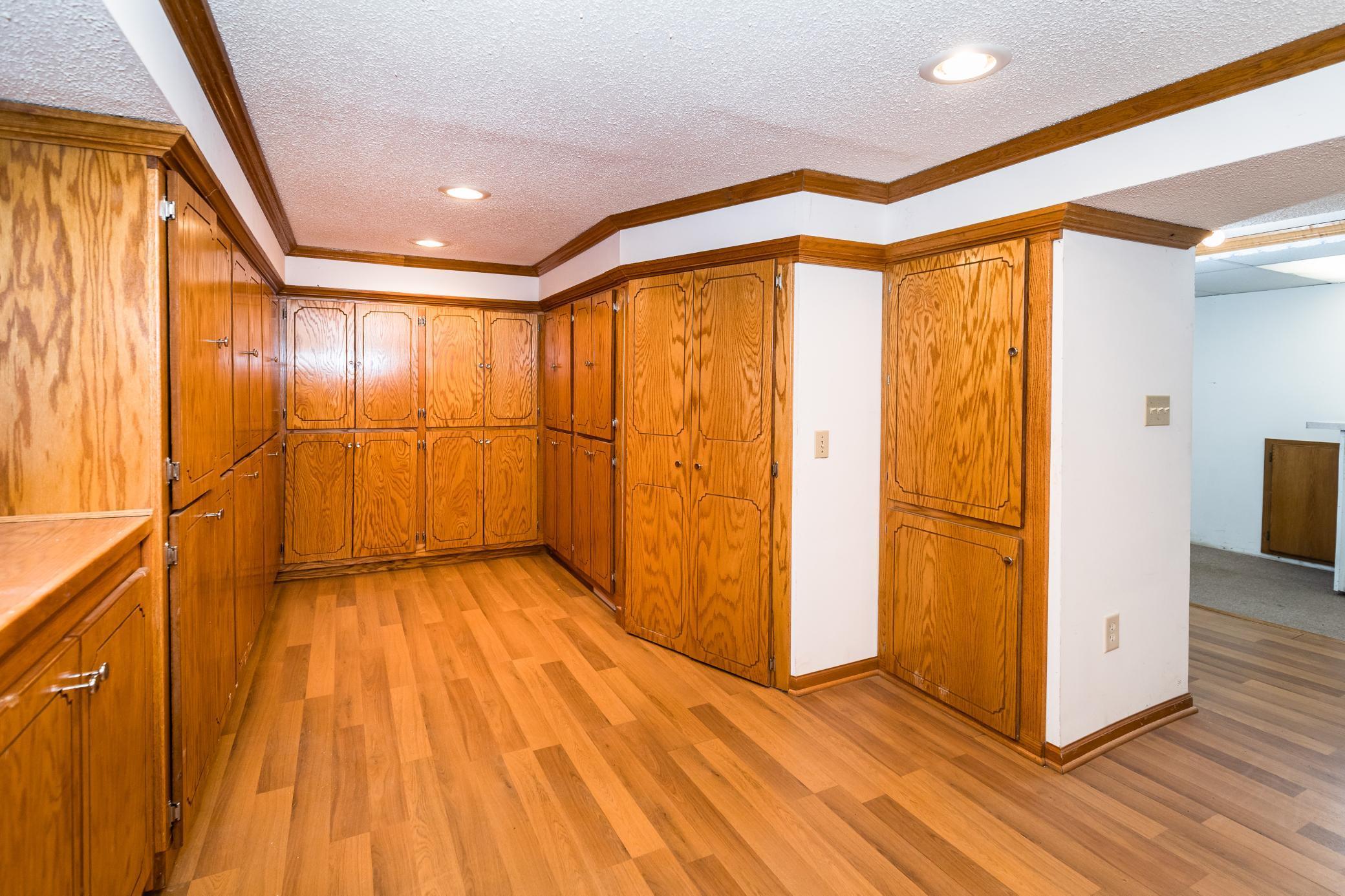 Currently a craft/flex room but could be used as a bedroom by removing the cabinets