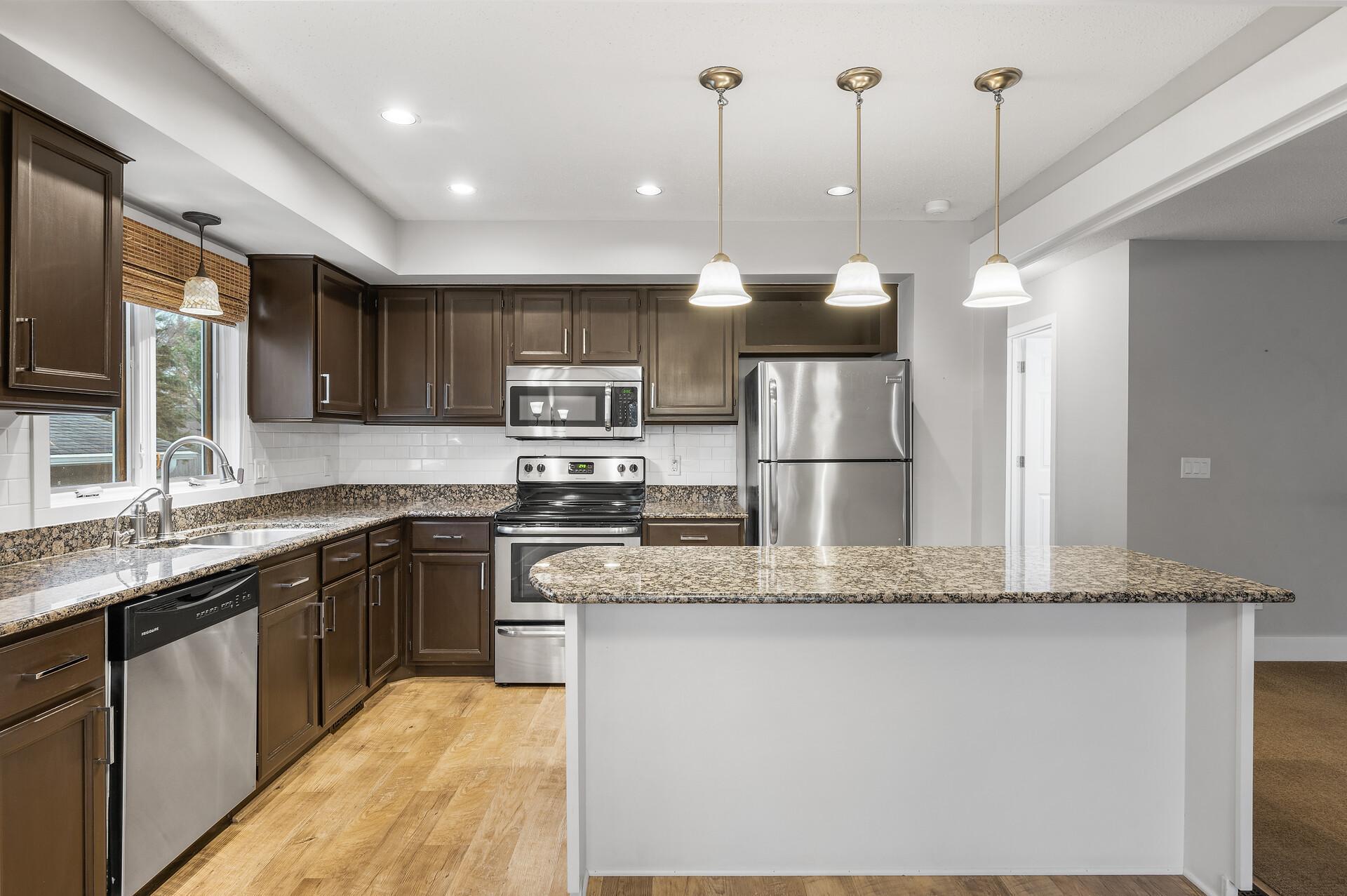 Another view of the kitchen which offers plenty of cabinet and counter space.