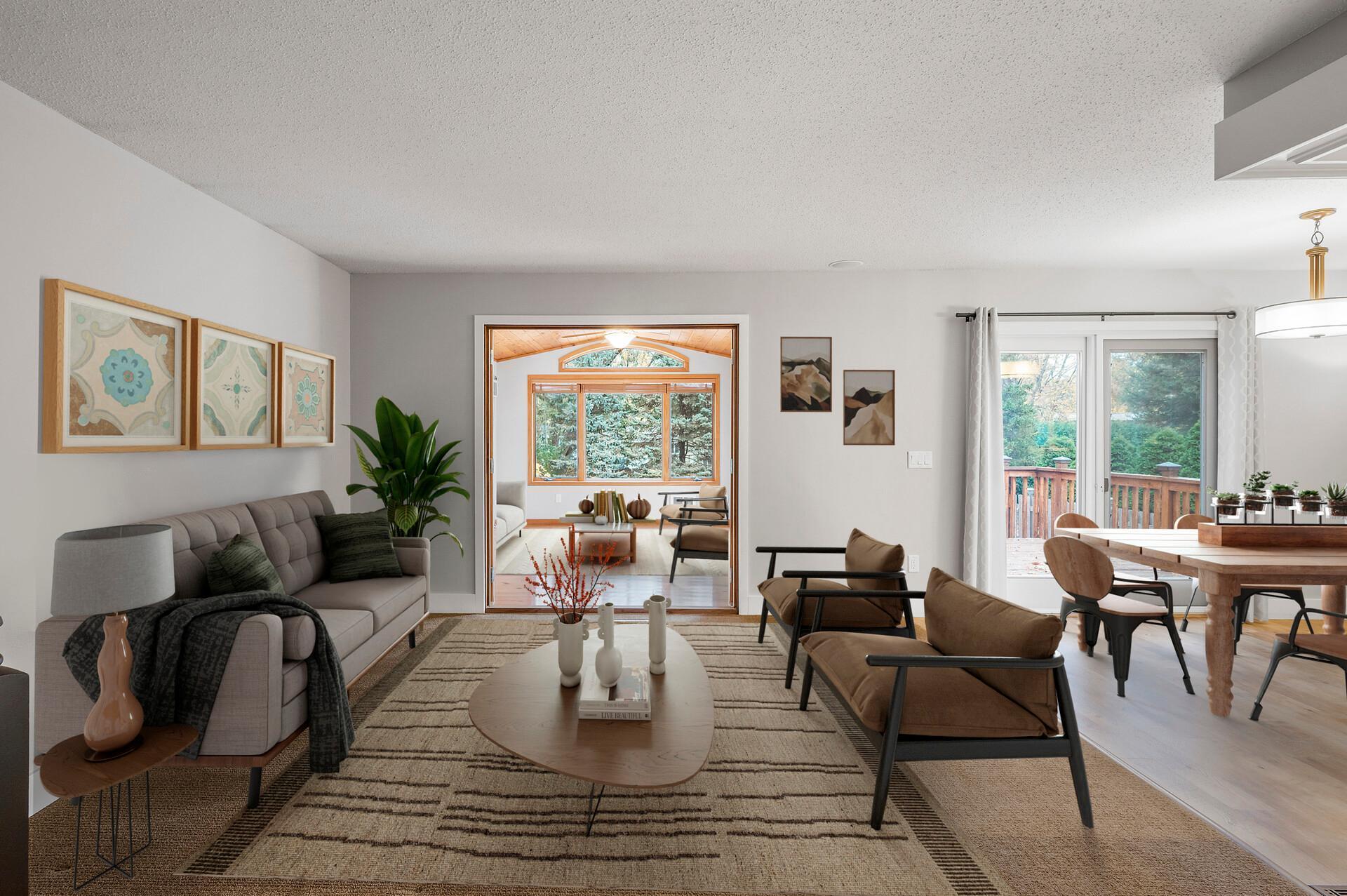 The open-concept upper level boasts a seamless flow between the living room, kitchen, and informal dining room, complemented by a fabulous four-season porch addition at the back—perfect for year-round enjoyment.