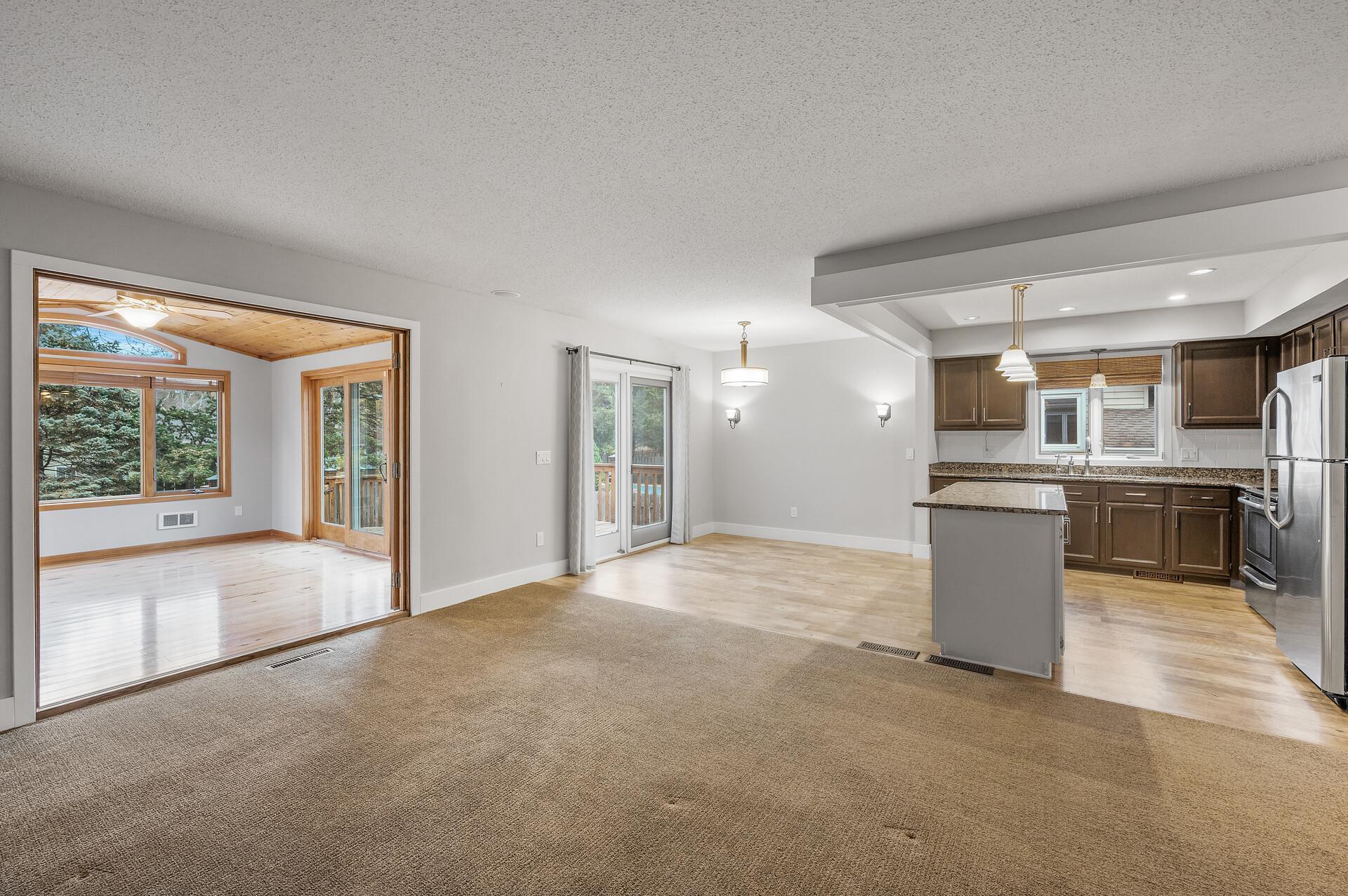 Here’s a view looking towards the kitchen and informal dining room, showcasing the open layout that encourages both cooking and conversation