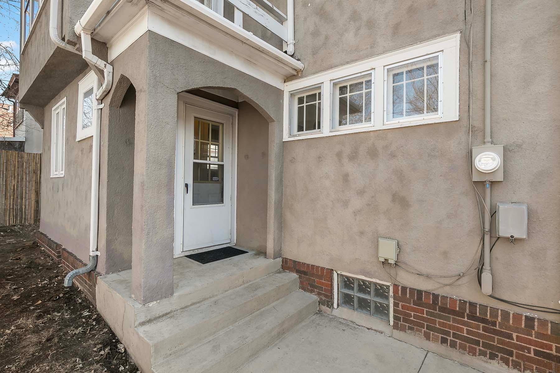 Covered rear entry. Note how the arches are repeated on the exterior.