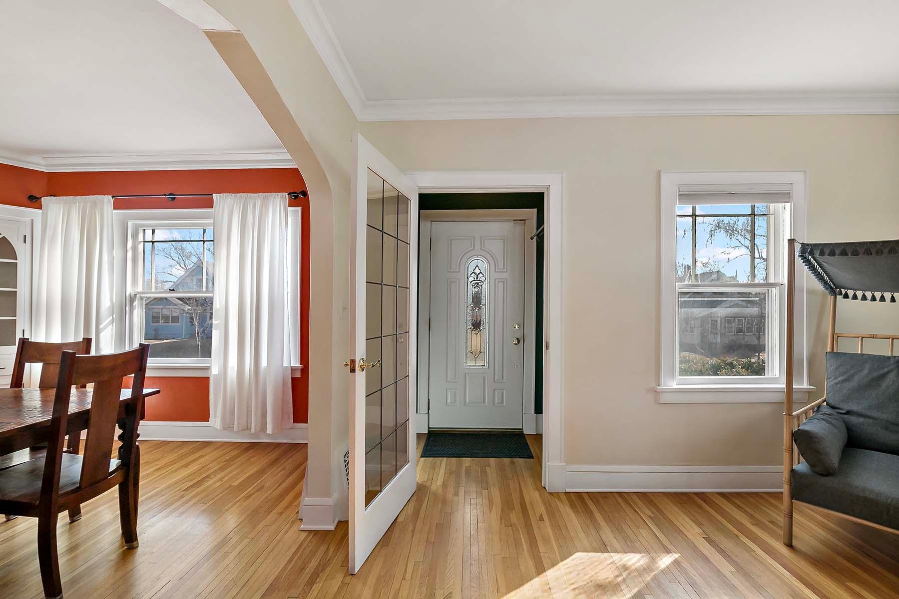The vestibule provides a welcoming spot to greet visitors, a buffer against the outdoor elements and noise plus a transition space into the living room and home.