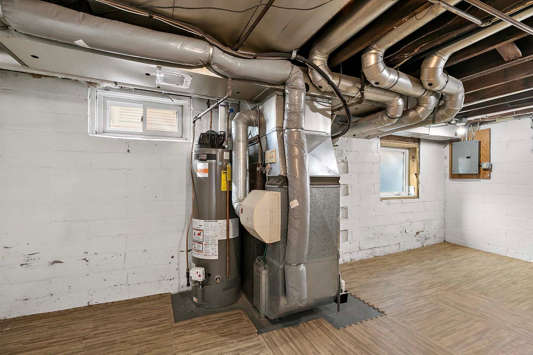 The basement has high ceilings, an egress window and a new power-vented hot water heater.