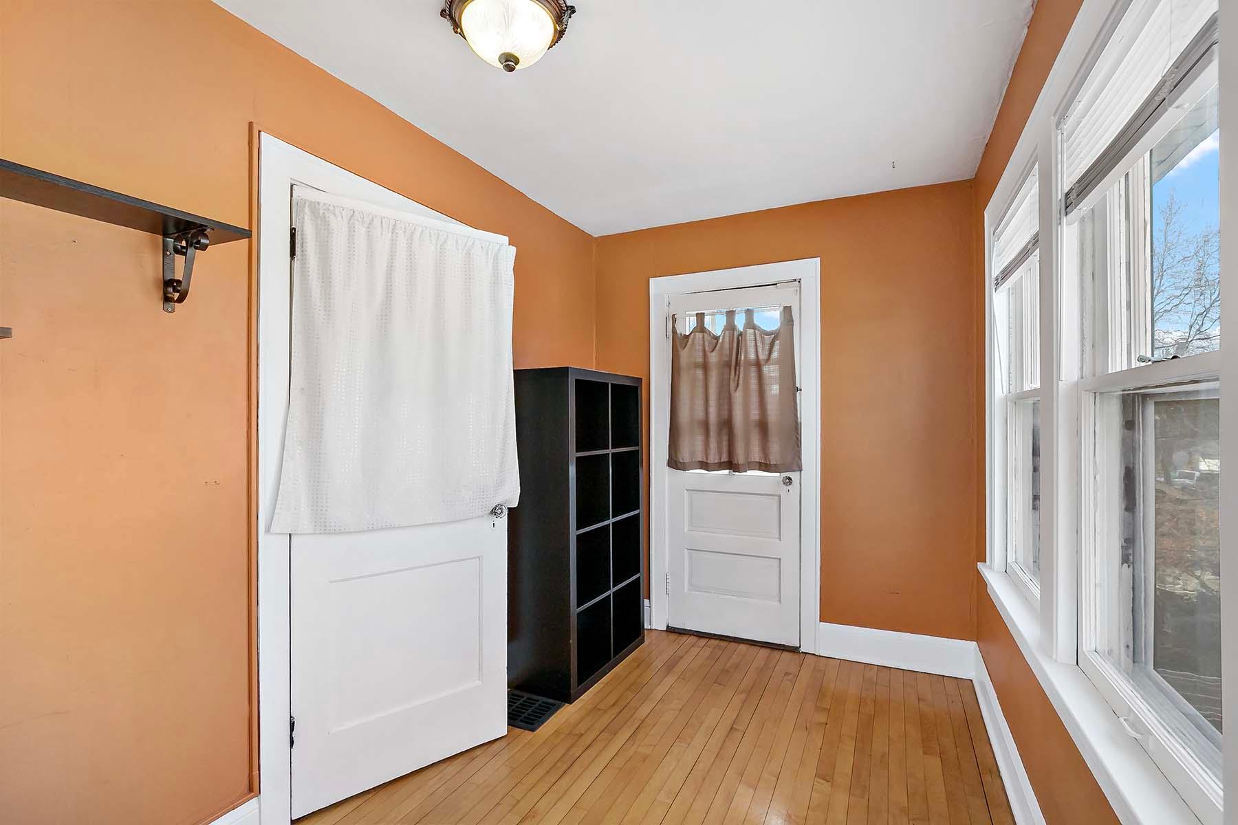 The sunroom features a shaker porch and often served as a 4th bedroom.