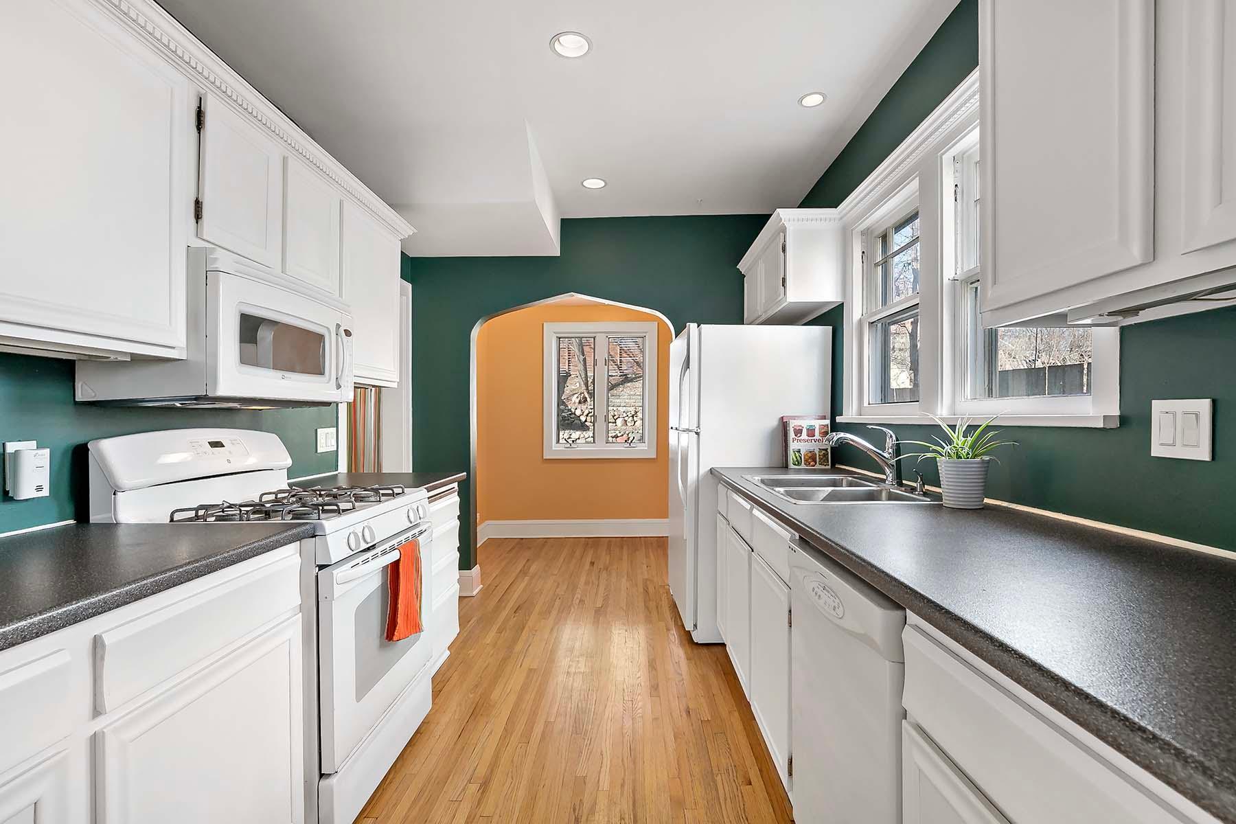 View from the dining room into the kitchen with an adorable breakfast nook.