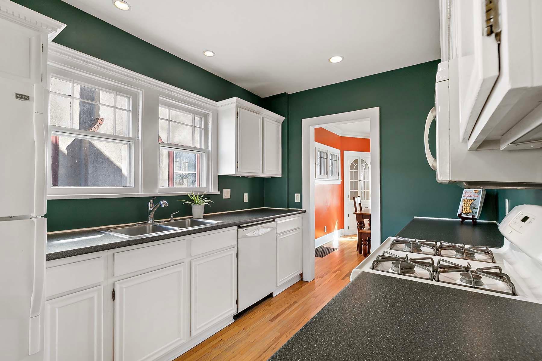Double windows above the sink and a dishwasher to the right.