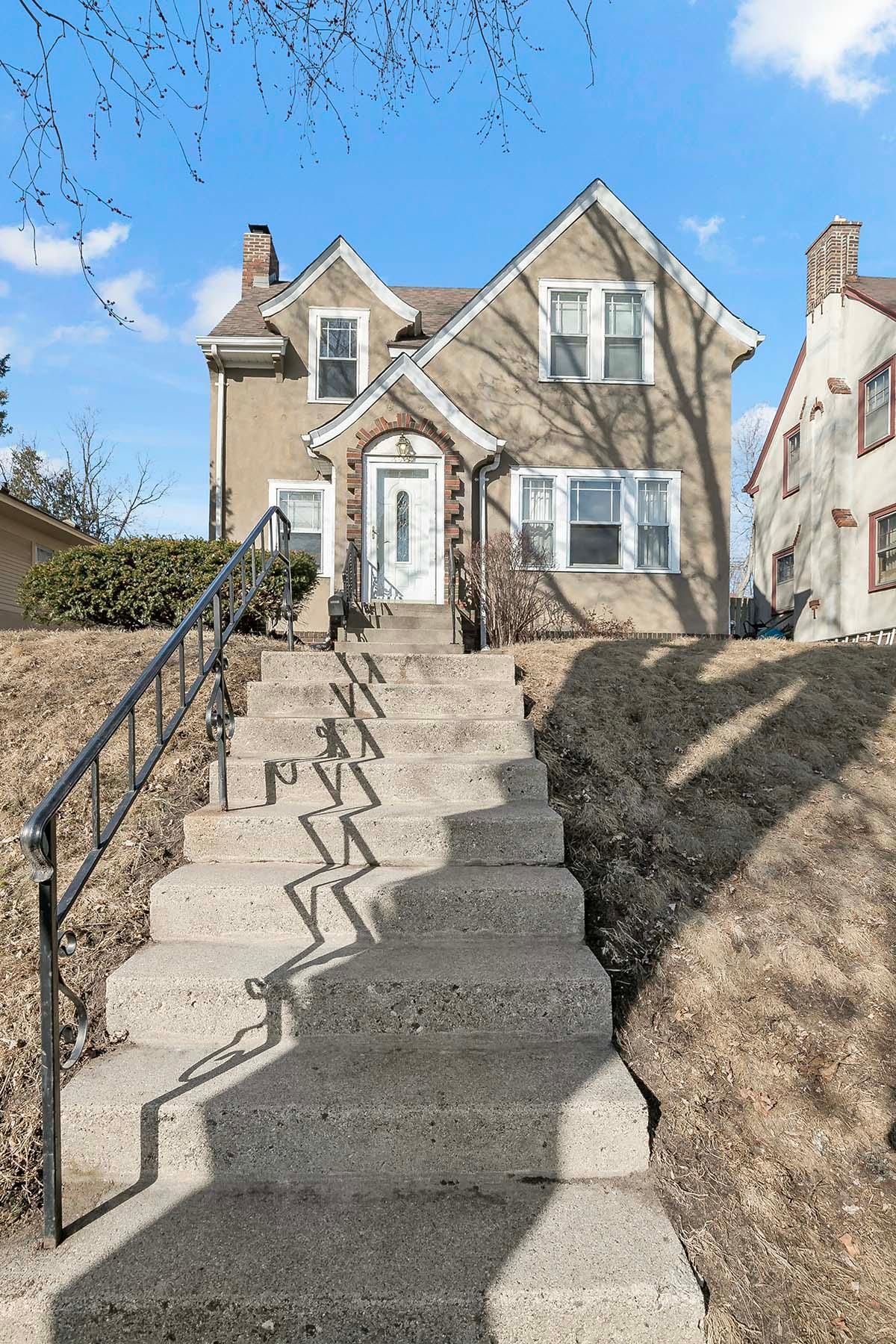 The gabled roof with curved eaves exemplifies the craftsmanship and design of the late 1920s.
