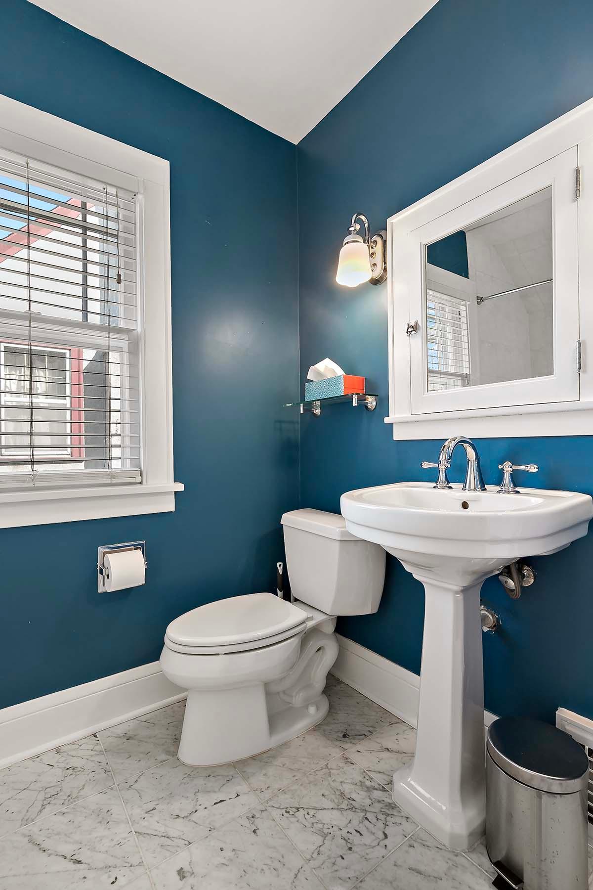 Upper-level full bath with décor and fixtures that complement the home's architecture and style.