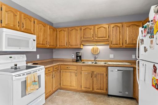 The kitchen offers plenty of counter and cabinet space, making it ideal for both cooking and entertaining.