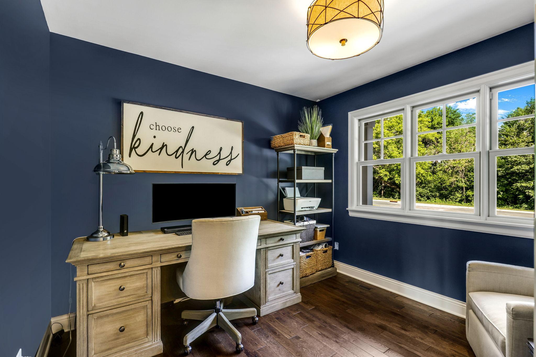The home office is conveniently located at the front of the home.