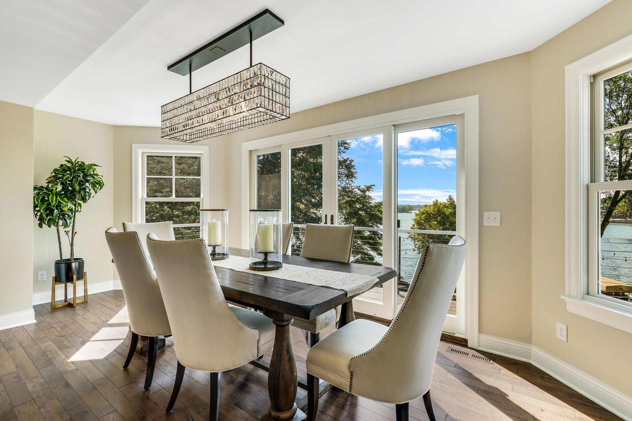 A spacious formal dining area sits perfectly to view the lake. The doors lead directly to the deck. All the windows and doors have been replaced in the home.