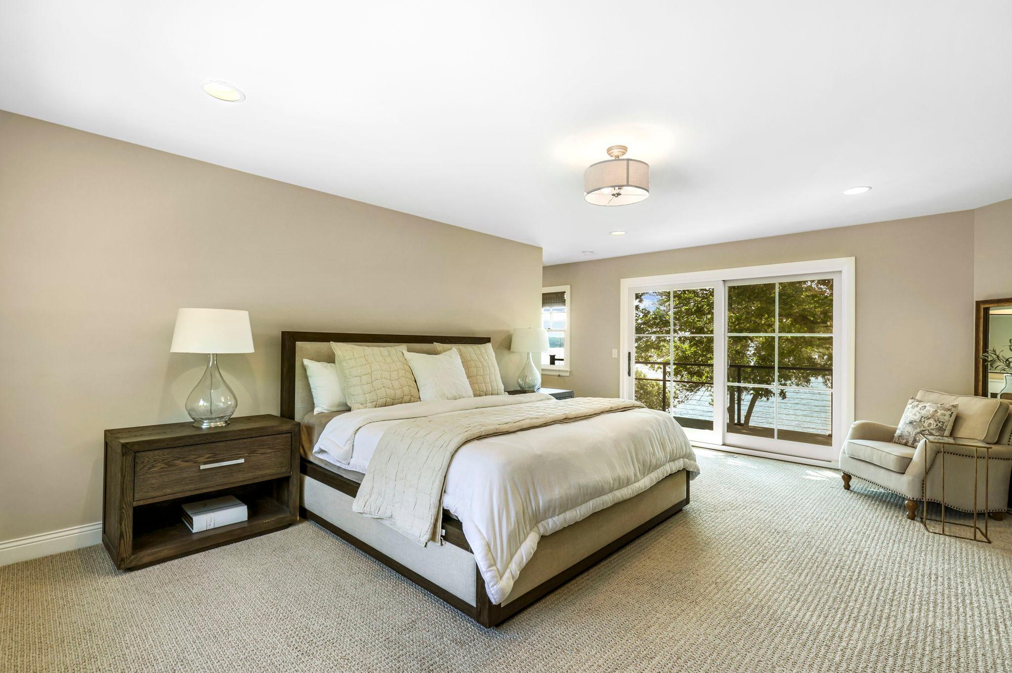 Head upstairs where you'll find three bedrooms and the laundry room. The primary suite is HUGE and has plenty of room for all your furniture. The door leads to your own private balcony!
