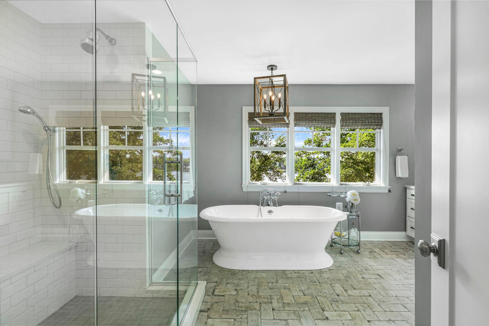 The spa like primary bathroom is tastefully designed and features heated ceramic tiled flooring, a dual vanity, soaking tub and a gorgeous, tiled shower.