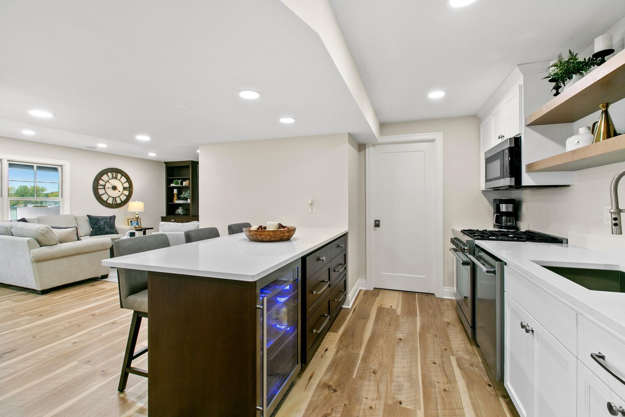 The door straight ahead leads to the mechanical room. This home has two furnaces and two A/C units (both newer since 2018) that provide two zone heating and air.