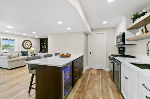 The door straight ahead leads to the mechanical room. This home has two furnaces and two A/C units (both newer since 2018) that provide two zone heating and air.