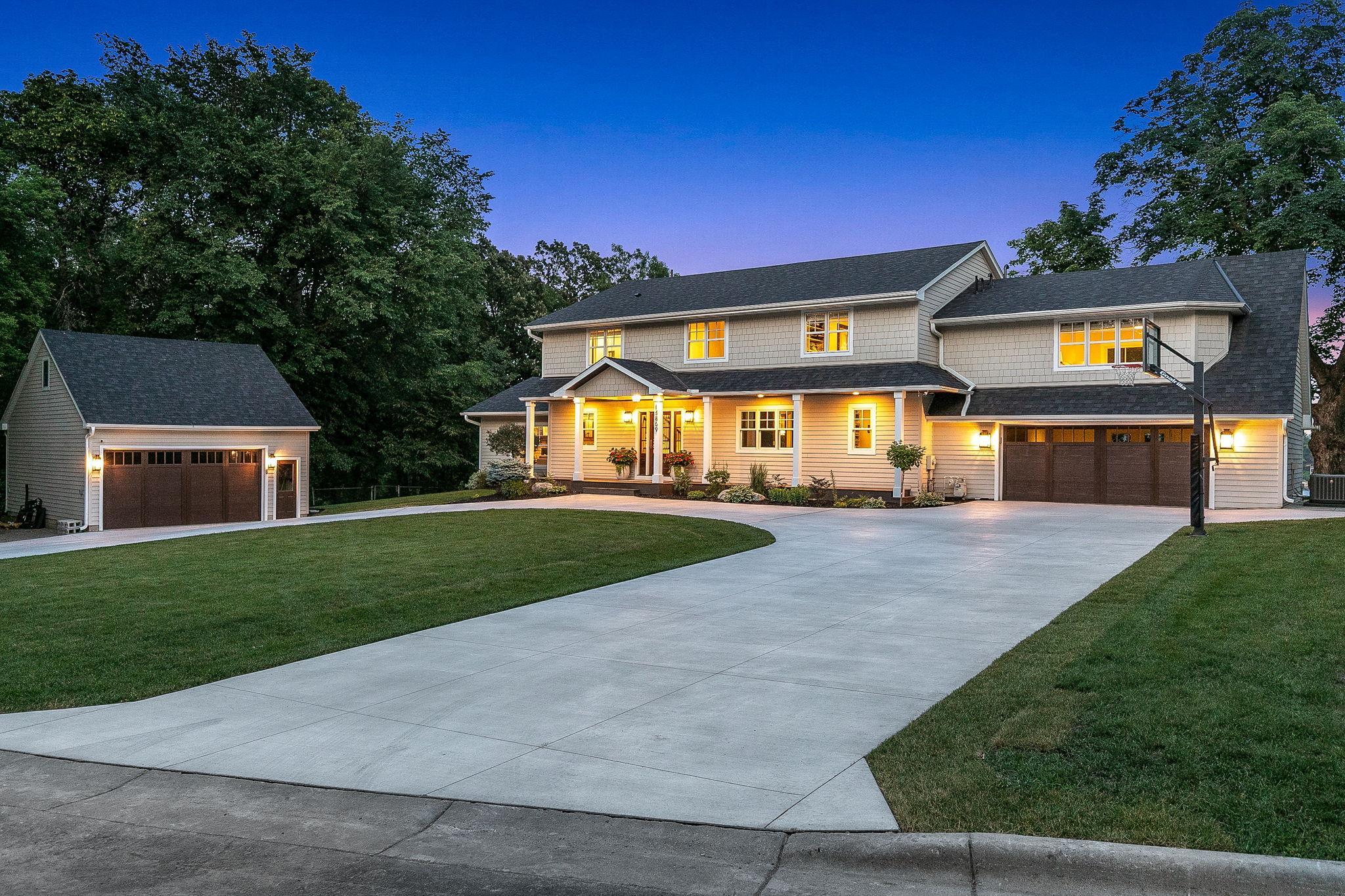 New Hardie Board siding and roof (2020). New driveway (2023) and garage doors (2022). Two car attached garage, and two car detached garage, both of which are heated. Room to finish off in the upper level of the detached garage.
