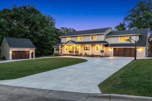New Hardie Board siding and roof (2020). New driveway (2023) and garage doors (2022). Two car attached garage, and two car detached garage, both of which are heated. Room to finish off in the upper level of the detached garage.