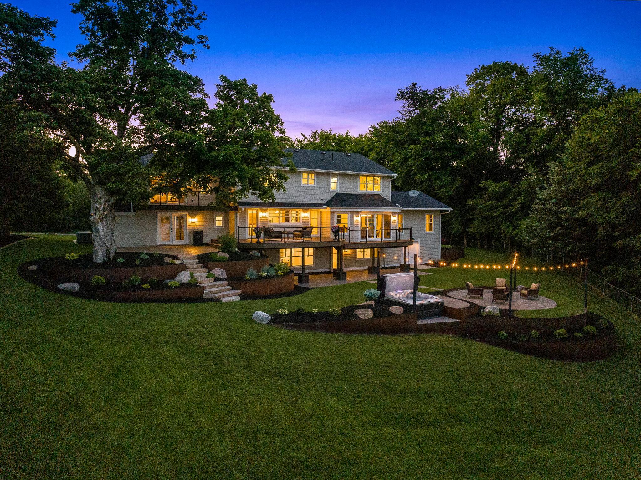 Tons of room to entertain family and friends in this pristine landscaped yard that offers a huge deck, two patios, built in firepit and built in hot tub.