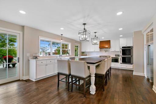 An expansive gourmet chef's kitchen awaits you! This space is absolutely wonderful for entertaining. Huge island, an abundance of storage and two pantries.