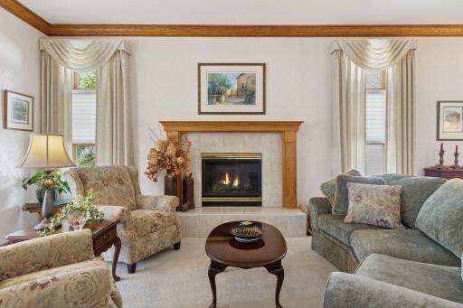 Main level living room features a gas fireplace