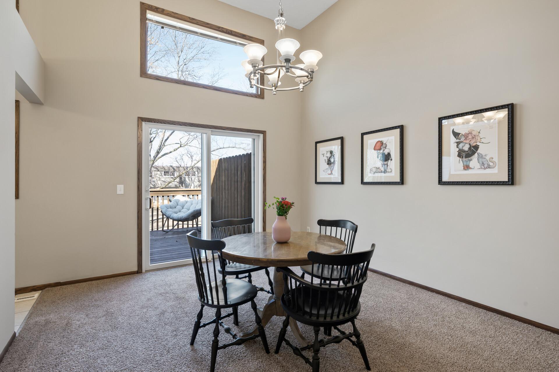 Welcome to 10466 W Bloomington Freeway! This fantastic townhome has stunning 2-story ceilings with large windows that fill the home with natural sunlight.