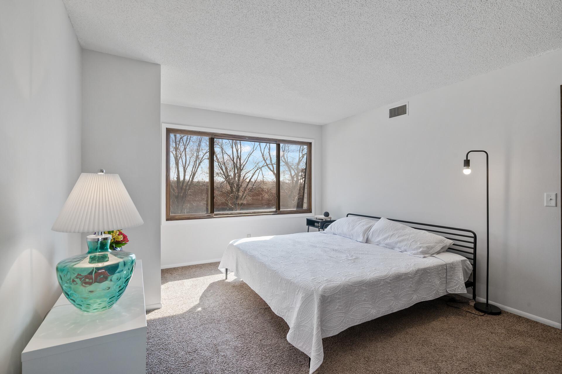 On the third floor you will find the sizable primary bedroom which has been freshly painted and offers a large window that fills the room with natural light.