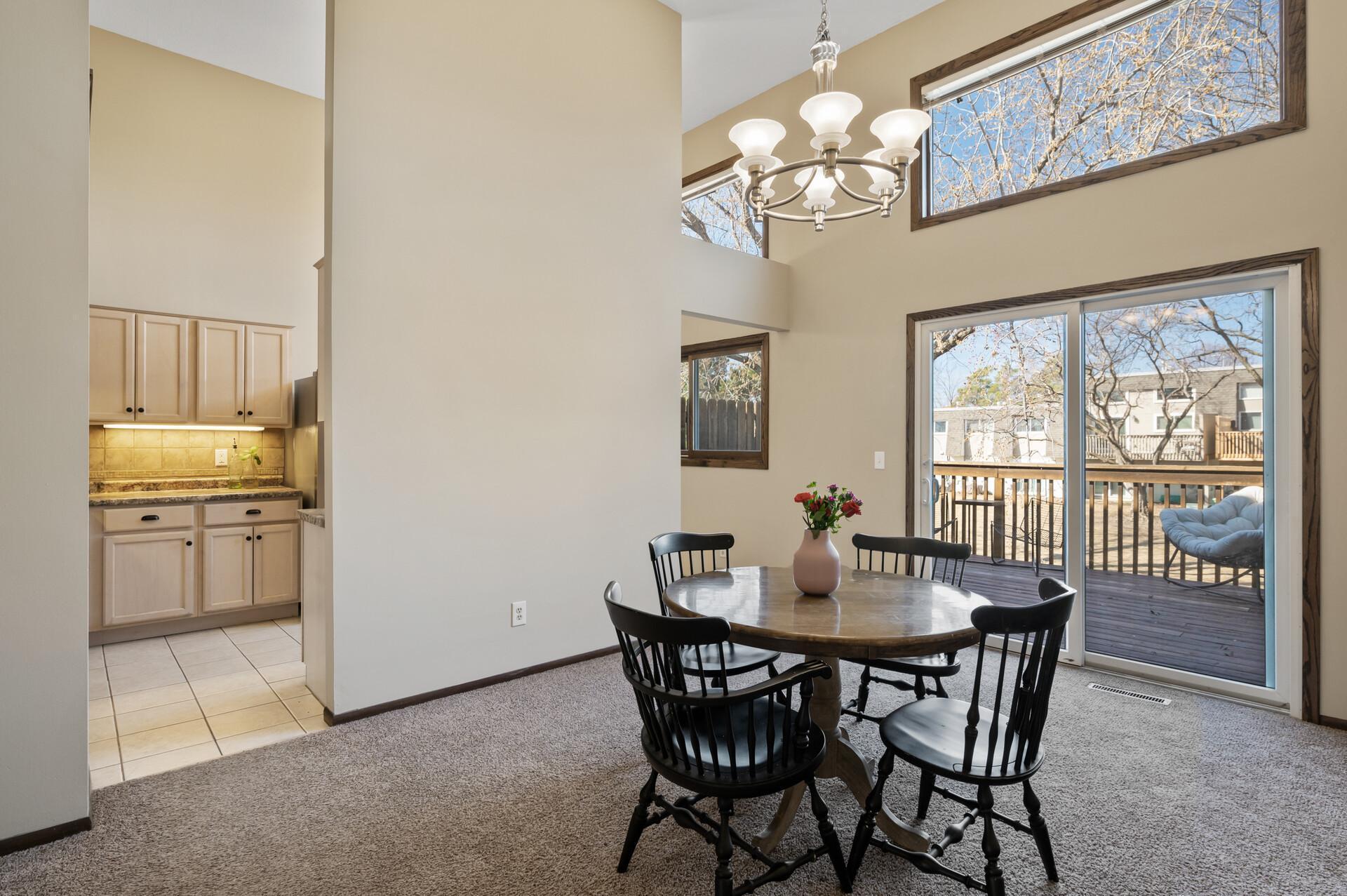 Here you can see the dining room and kitchen on the upper level. The dining room walks out to a sizable deck.