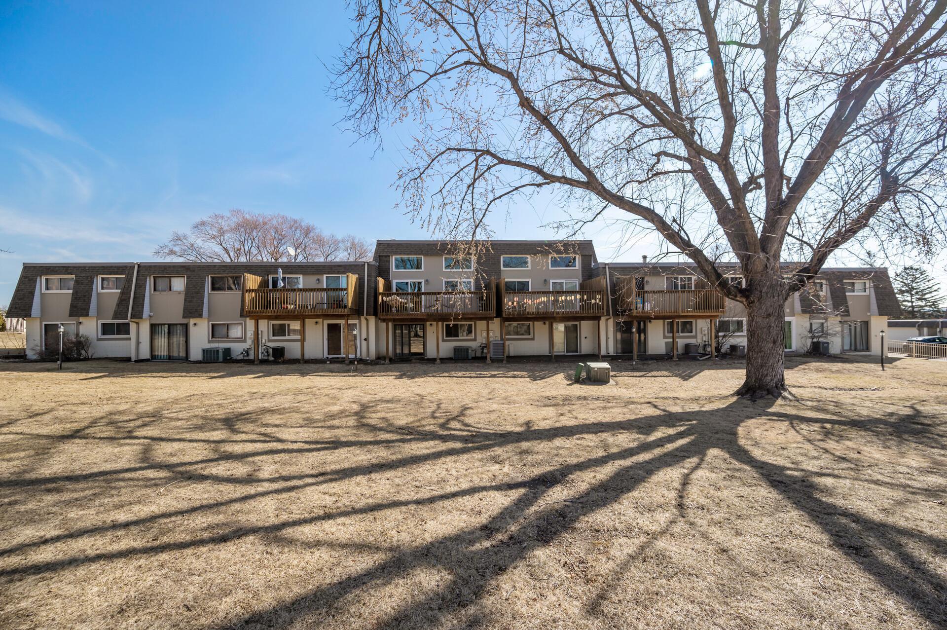 Look at this green space! This is truly a hidden gem, a townhome with a fully fenced front yard and this giant backyard.