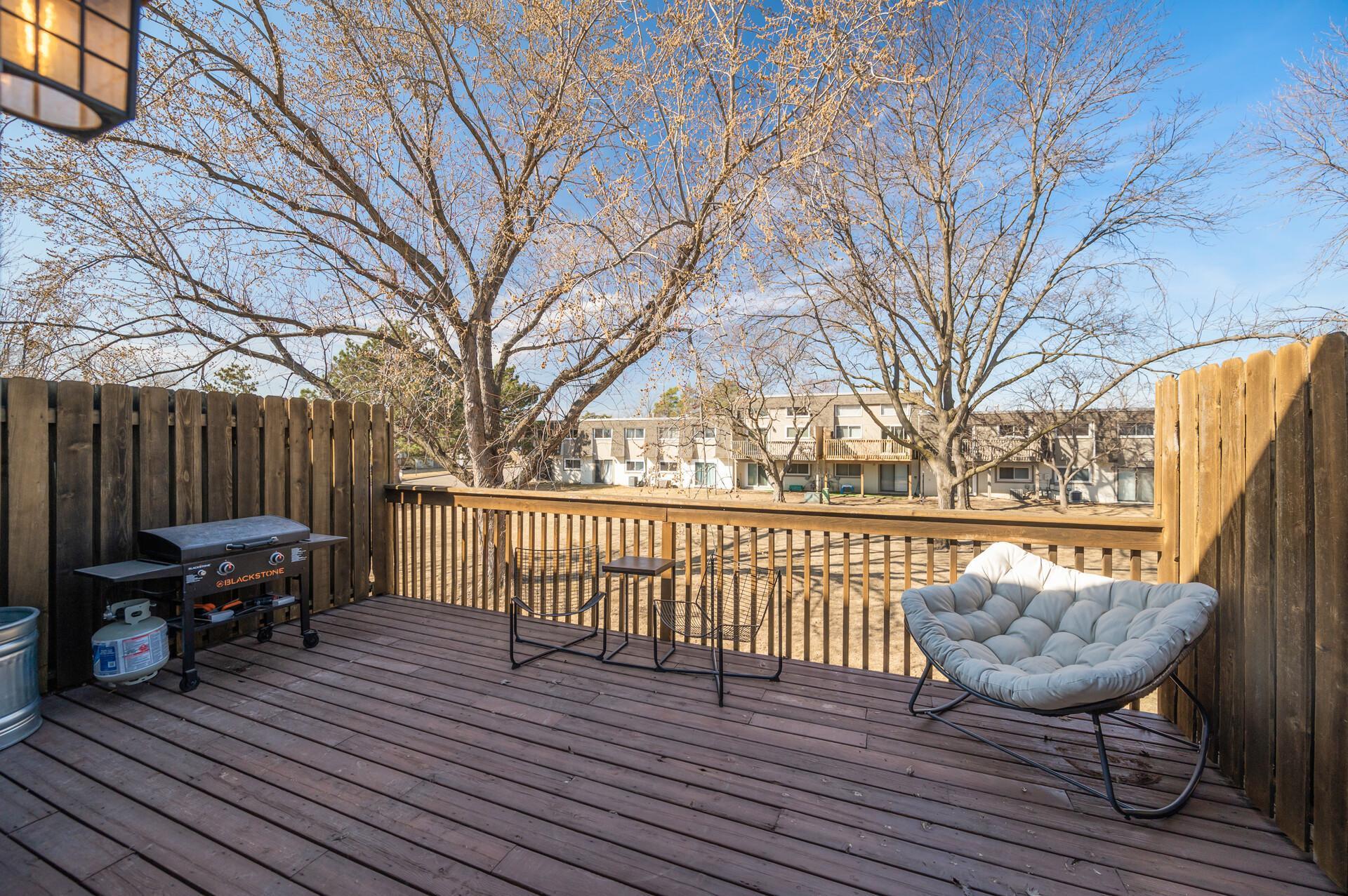 Notice the privacy fence on both ends of the deck and the mature trees that provide evening shade.