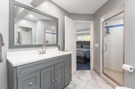 Outstanding remodel of the primary bath included recessed LED lighting, premium tile floor and ceramic step in shower.