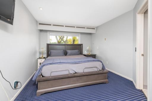 The large primary bedroom offers a beautifully remodeled three quarter bath and laundry room.