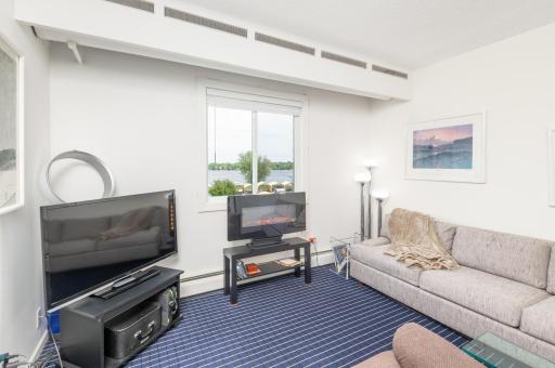 The third bedroom is off the living room, the doorway was opened up to create a handy flex room with nice closet and outstanding lake view.