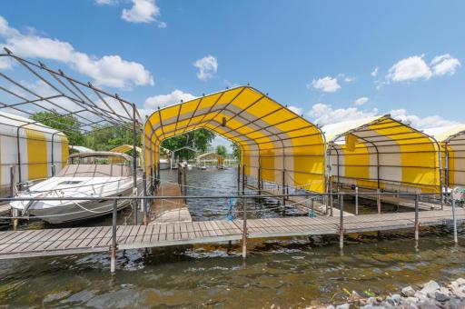 Your 27x13 covered slip is a short distance out the rear entrance and can hold a 31 foot boat. Electricity and water is onsite.
