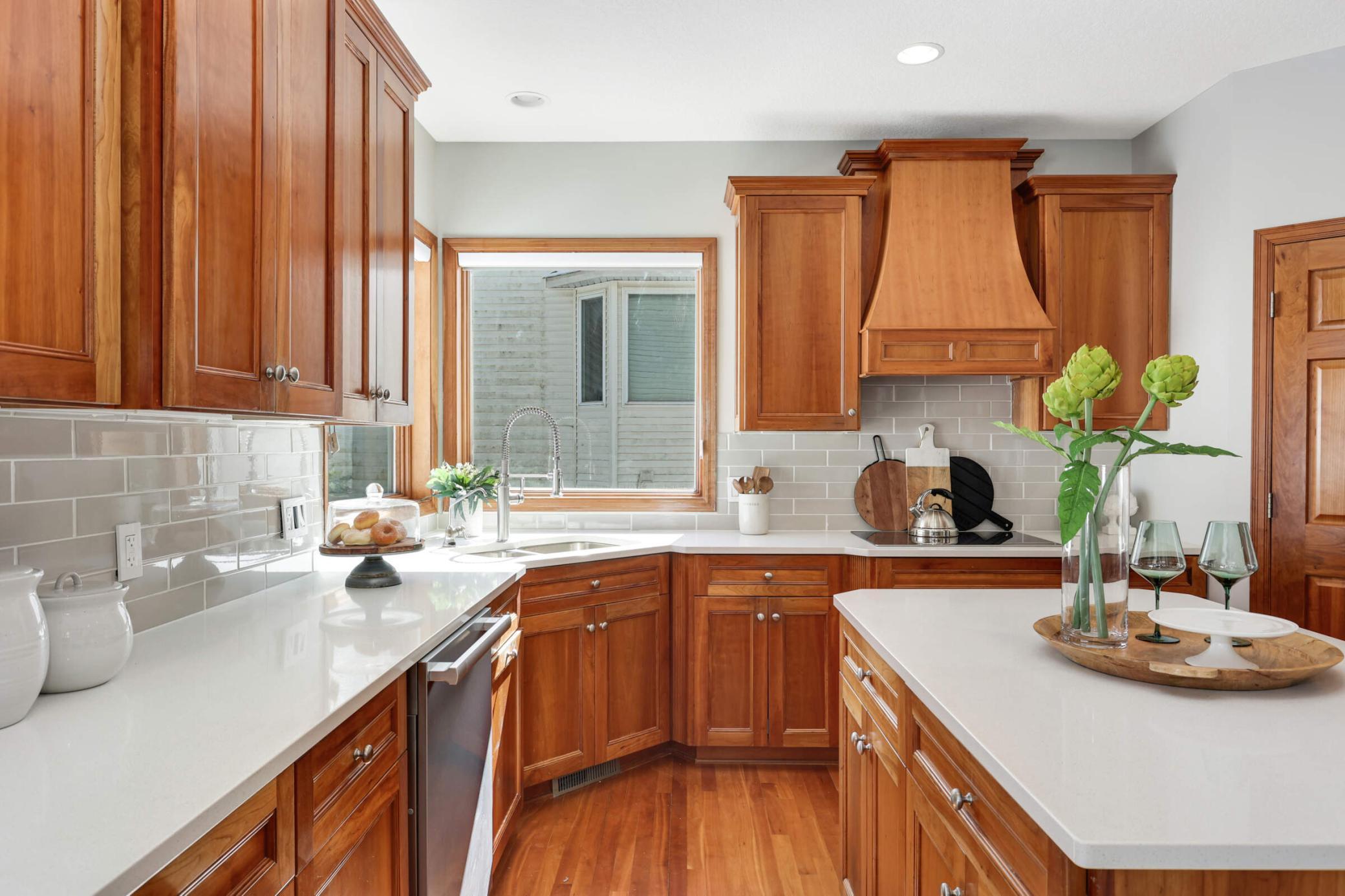 The cherrywood kitchen cabinetry combines beauty and practicality, offering generous storage to keep everything organized and your space looking elegant