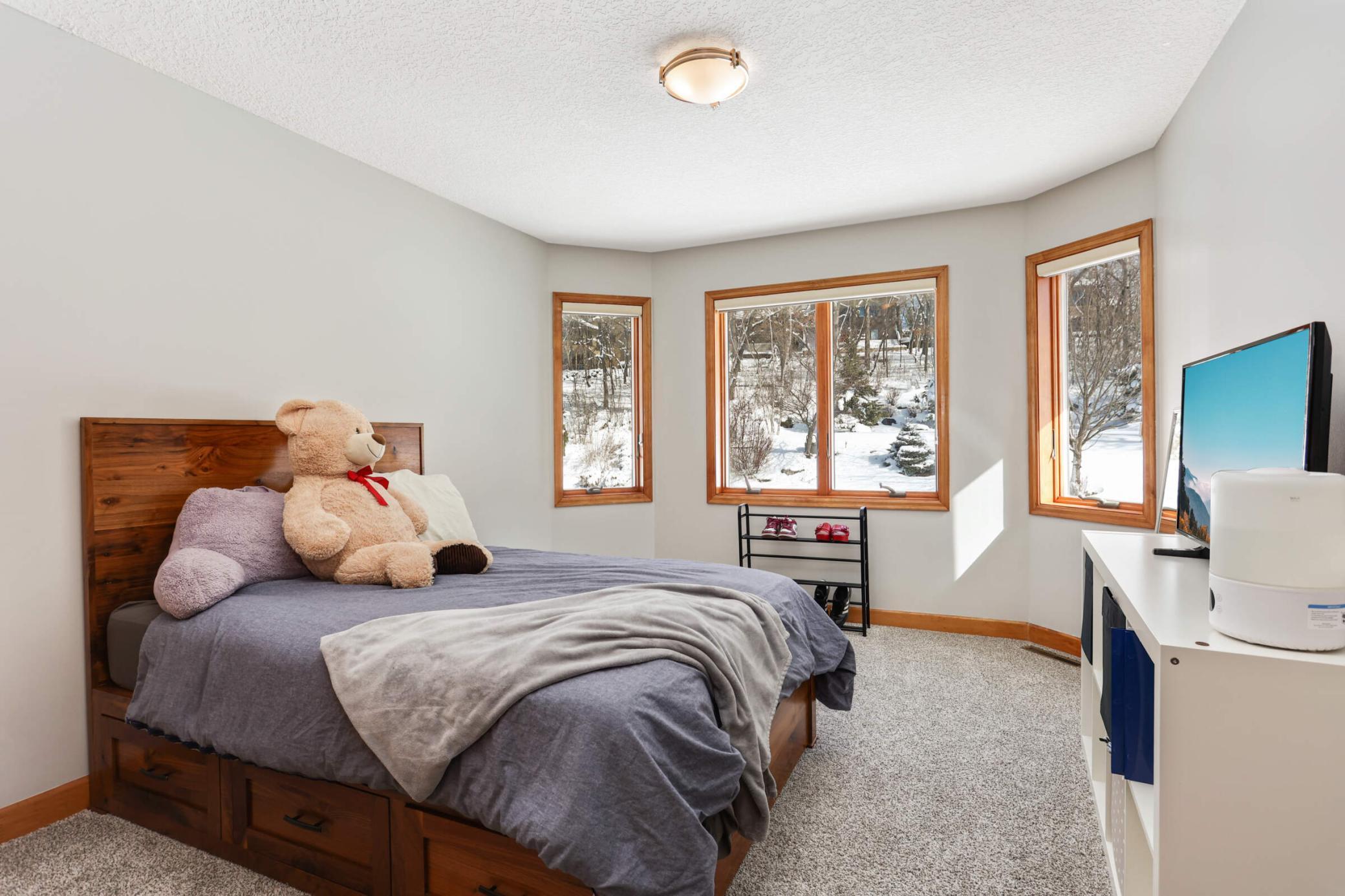 3rd bedroom offers spacious view of backyard