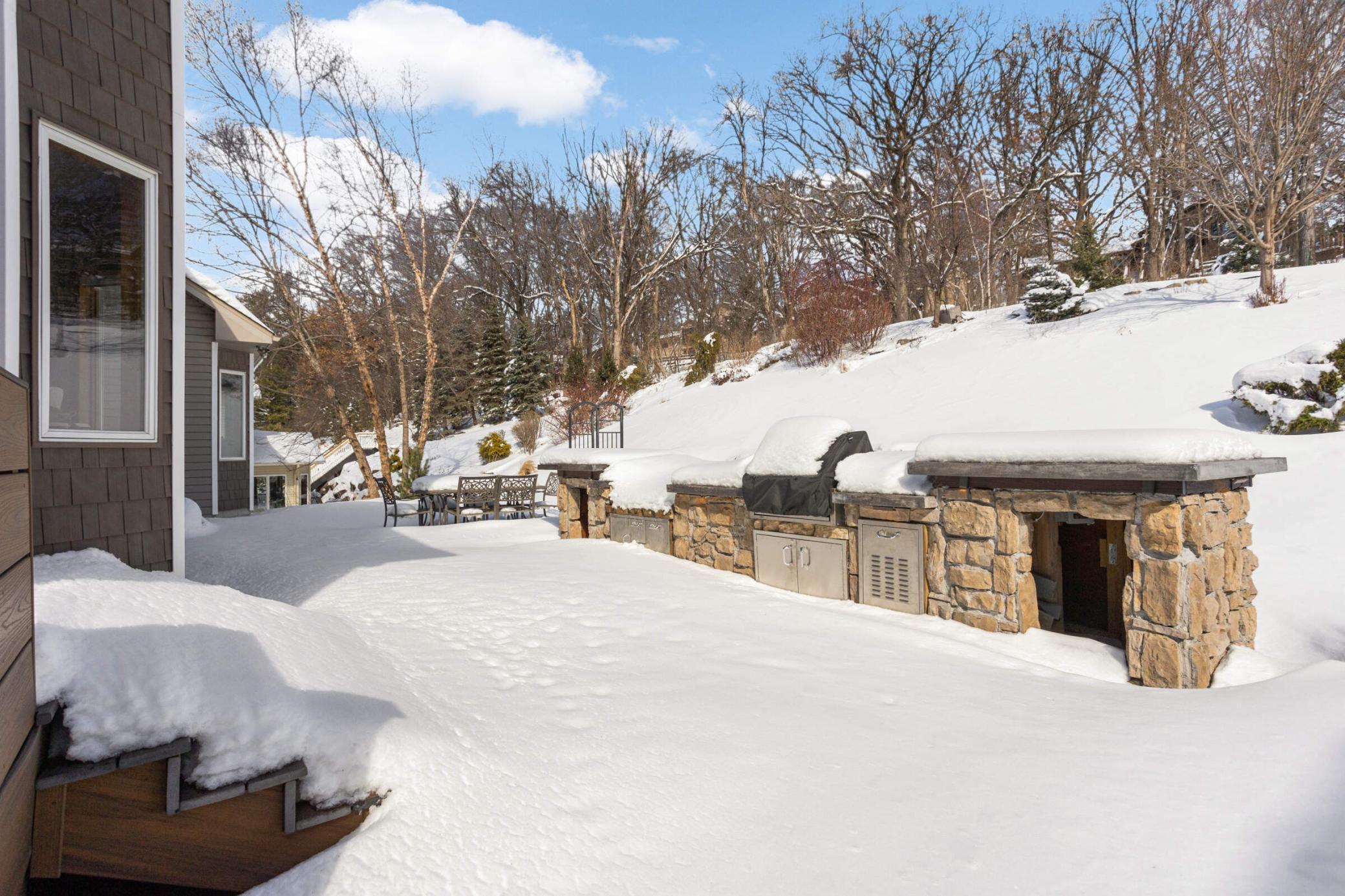AMAZING patio and outdoor entertaining area. The melting snow will reveal this outdoor oasis